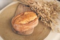 Sourdough bread close-up. Freshly baked round bread with a golden crust on a wooden board. Rustic wheat bread with space Royalty Free Stock Photo