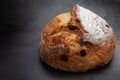 Sourdough bread with mixed fruits and nuts on dark cement background. Royalty Free Stock Photo