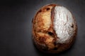 Sourdough bread with mixed fruits and nuts on dark cement background. Royalty Free Stock Photo