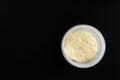 Sourdough for bread in a plastic container on a black background, top view, breeding Italian sourdough Levito Madre Royalty Free Stock Photo