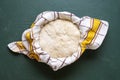 Sourdough set to rise in a bowl, top view