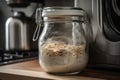 sourdough starter, fermenting in glass jar with airlock