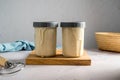 Sourdough starter in glass jars, bright background, copy space Royalty Free Stock Photo