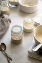 Sourdough starter in glass jars. Homemade breadmaking concept, busy lifestyle scene of baking at home. Sustainable living Royalty Free Stock Photo