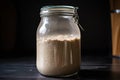 sourdough starter in jar, ready for its next cycle of baking and fermentation Royalty Free Stock Photo