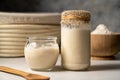 Sourdough starter in jars. Healthy wild fresh homemade yeast for sourdough bread baking. Royalty Free Stock Photo