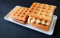 A Sourdough Waffle Stack on a White Plate