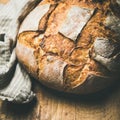 Sourdough wheat bread over rustic background, square crop Royalty Free Stock Photo