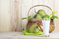 Soursop juice with soursop fruit in basket on wooden table.