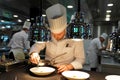 Sous chef plating dish at the Three Star Michelin L`Assiette Champenoise restaurant run by famous Chef Arnaud Lallement