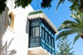 Low-angle view of a hotel window balcony in Andalusian style.