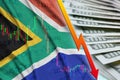 South Africa flag and chart falling US dollar position with a fan of dollar bills