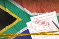 South Africa flag and Health insurance claim form with covid-19 stamp. Coronavirus or 2019-nCov virus concept