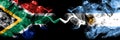 South Africa vs Argentina, Argentinian smoky mystic flags placed side by side. Thick colored silky abstract smoke flags concept