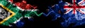 South Africa vs New Zealand, New Zealander smoky mystic flags placed side by side. Thick colored silky abstract smoke flags Royalty Free Stock Photo