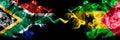 South Africa vs Sao Tome and Principe smoky mystic flags placed side by side. Thick colored silky abstract smoke flags concept