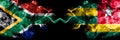 South Africa vs Togo, Togolese smoky mystic flags placed side by side. Thick colored silky abstract smoke flags concept