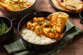 South Asian style, Indian dinner. Chicken curry with long rice and naan bread. Royalty Free Stock Photo