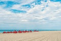 Red deck chairs, umbrellas on coast, South Beach, Miami, Florida Royalty Free Stock Photo