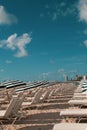 South Beach Miami: white and blue striped umbrellas and sunbeds on the beach. Beach life, vacation, holiday mood