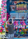 Man Playing basketball carnival game Royalty Free Stock Photo