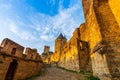 Walk between the fortified walls of the City of Carcassonne, in the Aude.