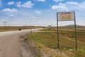 A South Dakota State welcome sign along the US Highway 212 in the USA, with a biker riding his motorcycle