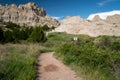 Hikers climb the Cliff Shelf Nature Trail in Badlands National Park