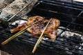 South East and East Asia: Typical Asian Food. Grilled chicken. Grilled BBQ Chicken. Barbecued chicken on charcoal stove