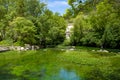 South of France, view on small Provencal town of poet Petrarch Fontaine-de-vaucluse with emerald green waters of Sorgue river Royalty Free Stock Photo