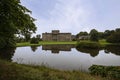 The south front of Lyme Park House with the south lawn and the reflection lake.