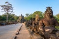 South gate bridge of Angkor Thom with statues of gods and demons Royalty Free Stock Photo