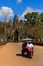 South Gate of Angkor Thom with local tuk-tuk car Royalty Free Stock Photo