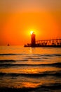 South Haven`s lighthouse and pier on Lake Michigan at sunset Royalty Free Stock Photo