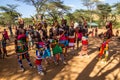 SOUTH HORR, KENYA - FEBRUARY 12, 2020: Group of Samburu tribe young men dancing wearing colorful headpieces made of