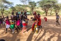 SOUTH HORR, KENYA - FEBRUARY 12, 2020: Group of Samburu tribe young men and women dancing wearing colorful headpieces