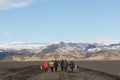 South Iceland Tourist walking to famous landmark the abandoned wreck of a US military plane on Solheimasandur