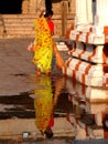 South India, Karnataka, Hospet, Hampi State Temple, woman cleaning the square