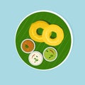 South Indian breakfast dish `Vada with Sambar and Chutney` on banana leaf