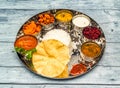 south indian chicken meal thali tikka masala, curry, rice, raita, korma, kesari halwa and chapati served in dish isolated on Royalty Free Stock Photo