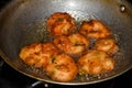 south indian cuisine - Vada or Medu vadai frying in coconut oil. Very popular south Indian snack