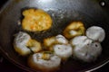 south indian cuisine - Vada or Medu vadai frying in coconut oil. Very popular south Indian snack