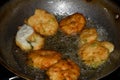 south indian cuisine - Vada or Medu vadai frying in coconut oil. Very popular south Indian snack