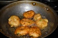 south indian cuisine - Vada or Medu vadai frying in coconut oil. Very popular south Indian snack