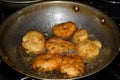 south indian cuisine - Vada or Medu vadai frying in coconut oil. Very popular south Indian snack