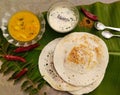 South Indian dosa with sambar, coconut chutney and podi chutney. Royalty Free Stock Photo