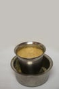 Close up view of South Indian filter coffee on white background