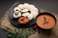 South indian food idli sambar or sambhar podi coconut chutney with curry leaves and red chillies Royalty Free Stock Photo