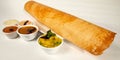 South Indian Masala Dhosa served with sambhar coconut chutney red chutney and green chutney