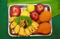 South Indian prayer items on a wedding day, coconut with fruit and betel leaf, Turmeric